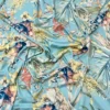 Abstract Floral Garden On Light Blue Satin Fabric
