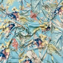 Abstract Floral Garden On Light Blue Satin Fabric