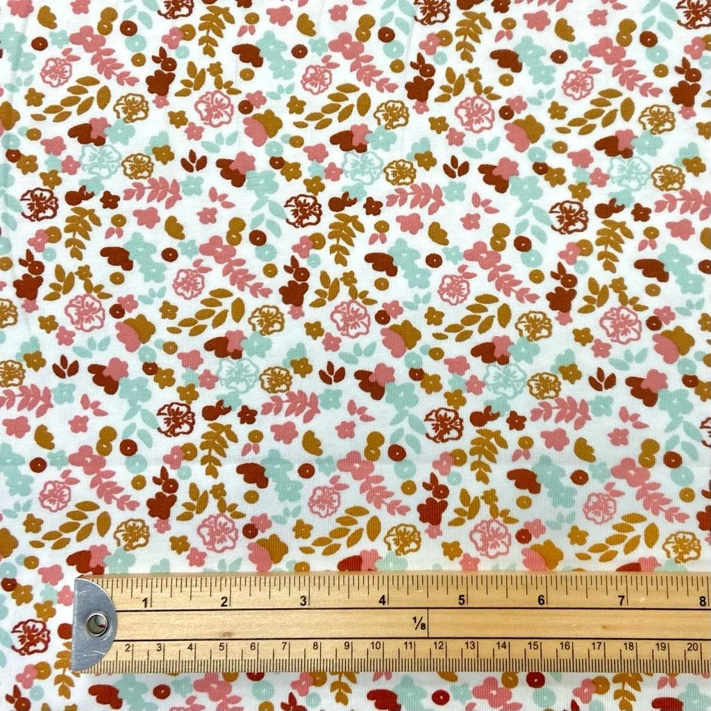 Mini Cartoon Flowers On White Cotton Jersey Fabric 2 Mini Cartoon Flowers On White Cotton Jersey Fabric - Image 2