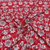 Blue And White Flower Shapes On Red Lycra Spandex Fabric