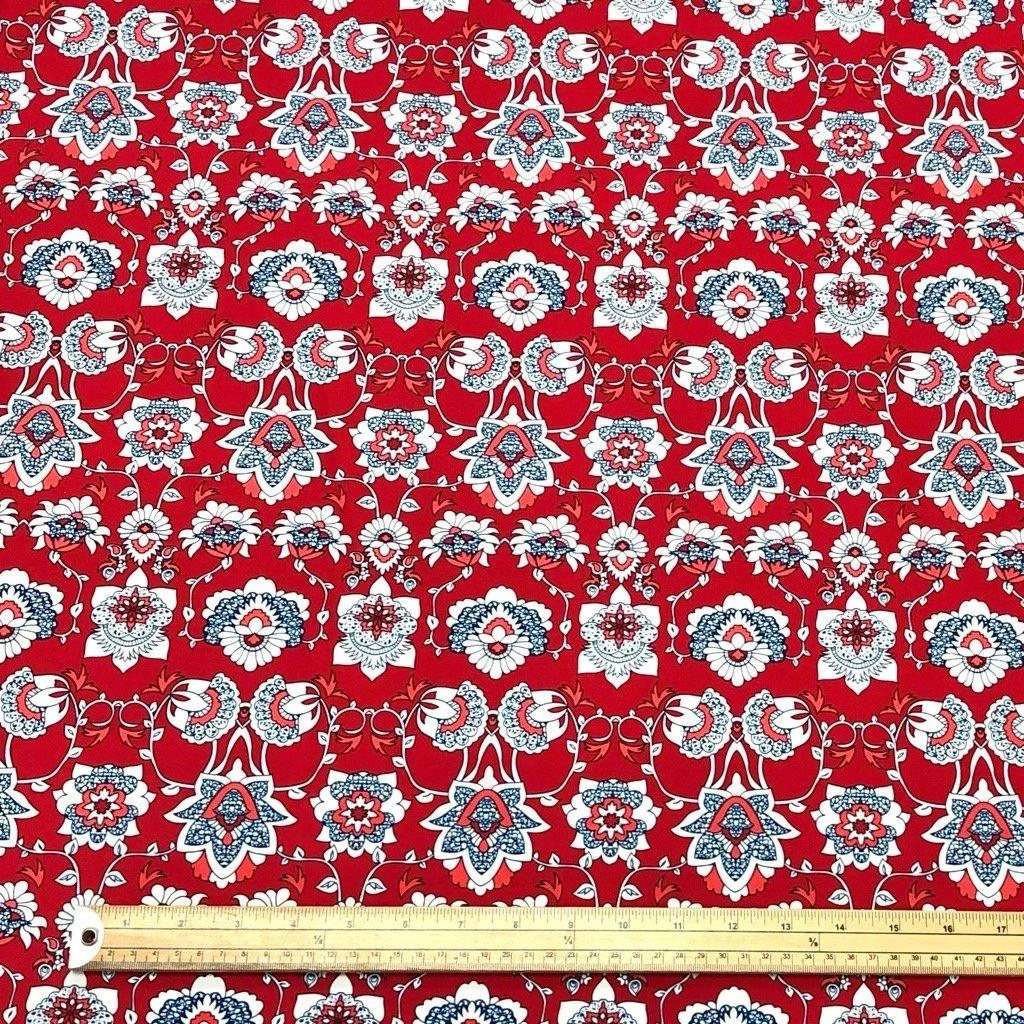 Blue And White Flower Shapes On Red Lycra Spandex Fabric 2 Blue And White Flower Shapes On Red Lycra Spandex Fabric - Image 2