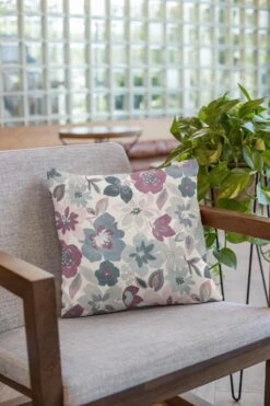 Large Floral Garden On White Panama Fabric -Ernst Fabric Store mockup of a pillow on an armchair 23550 16