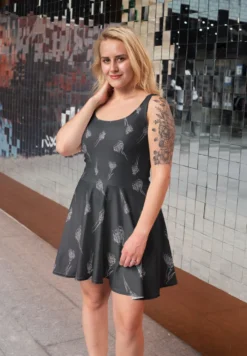Grey And White Drawn Flowers On Black Satin Fabric -Ernst Fabric Store skater dress mockup featuring a woman posing on the street 28008 1